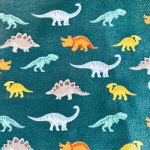 Dinosaurs on Green Flannel Fabric
